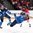 KAMLOOPS, BC - APRIL 3: Finland's Sanni Hakala #14 goes airborn after getting tangled up with teammate Sara Sakkinen #23 and Canada's Jillian Saulnier #11 during semifinal round action at the 2016 IIHF Ice Hockey Women's World Championship. (Photo by Andre Ringuette/HHOF-IIHF Images)

